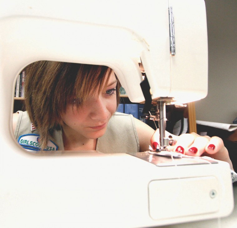 Girl Scouts make dresses for Swaziland